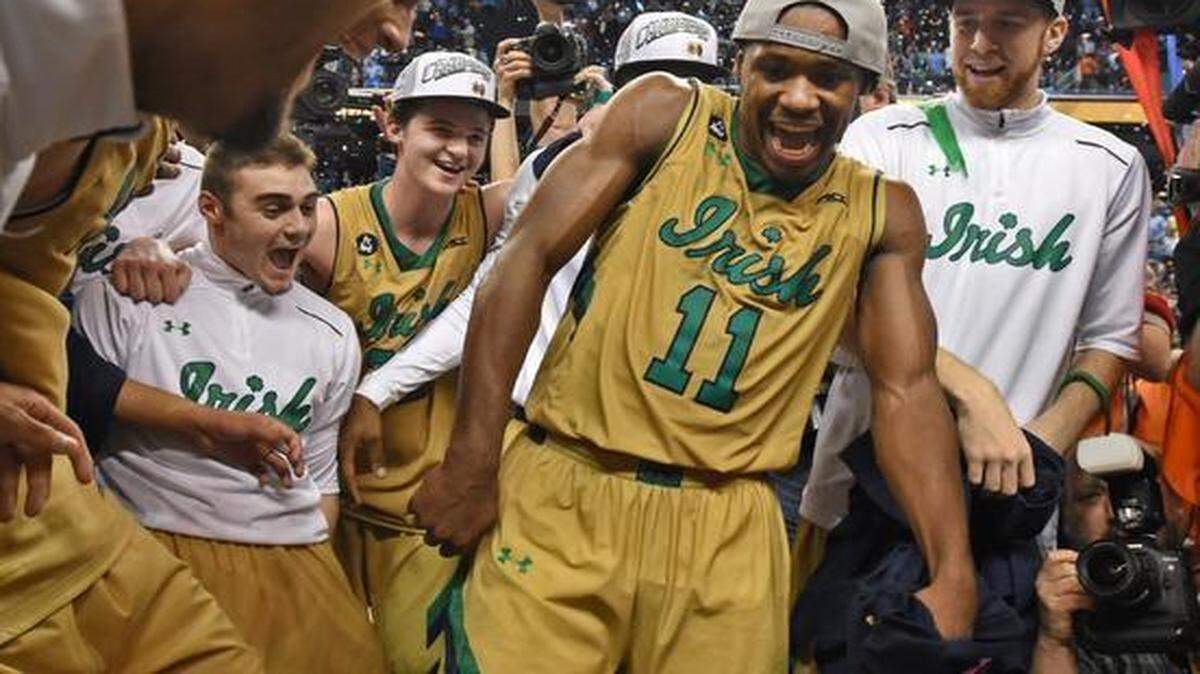 
Notre Dame’s Demetrius Jackson (11) dances for teammates after the Fighting Irish defeated North Carolina 90-82 to win their first Atlantic Coast Conference men's basketball tournament championship Saturday, March 14, 2015 in Greensboro.

