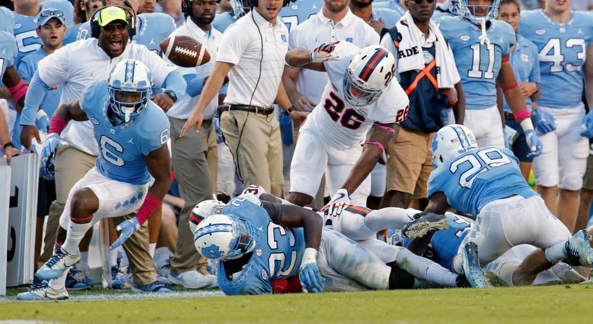 UNC's M.J. Stewart (6) goes for a fumble during the fourth quarter of an ACC college football game played between the UNC Tar Heels and the Virginia Cavaliers at Kenan Stadium in Chapel Hill, NC, on Oct. 14, 2017. He thought he recovered it and dashed down the sidelines, but he was ruled to have been out of bounds when he grabbed the ball. Virginia beat UNC, 20-14.