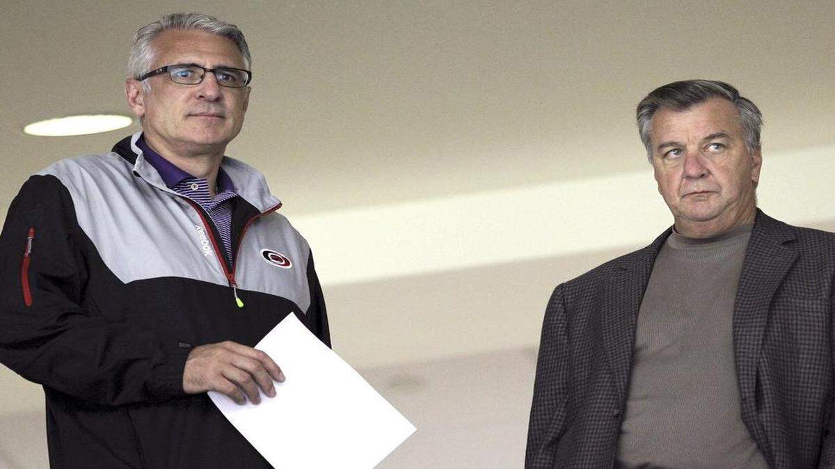 
Canes General Manger Ron Francis, left, and team President Don Waddell watch the team during a skating drill in the Carolina Hurricanes development camp held last July. Jim Rutherford held both positions previously. Now Francis handles the hockey side of the operations, Waddell, the business side.
