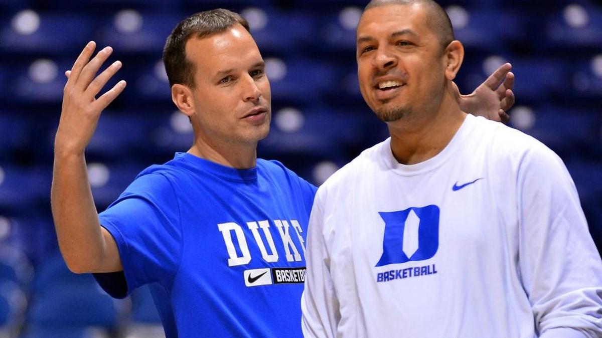 Duke associate head coach Chris Collins speaks with then assistant coach Jeff Capel at Lucas Oil Stadium on March 28, 2013.