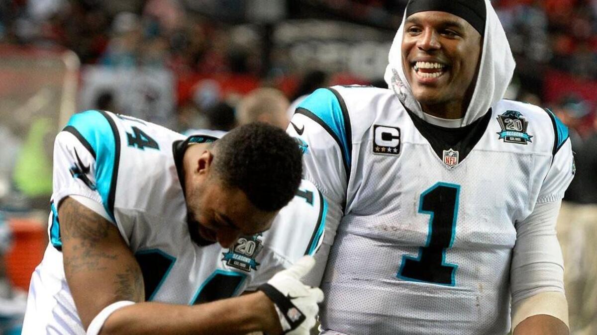 
Carolina Panthers third-string quarterback Joe Webb, left, says former Packers and Vikings quarterback Brett Favre and Panthers quarterback Cam Newton, right, are "very similar. Brett is a jokester, a prankster, and Cam's the same way. Big personalities. They just love to have fun and enjoy life."


