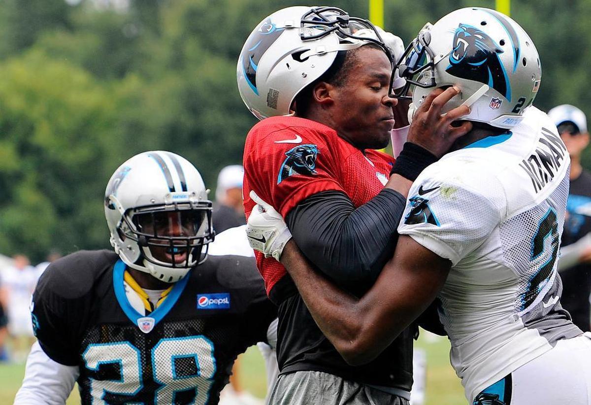 In 2015, Cam Newton (left) and Josh Norman fought during a training-camp practice. Norman said that the two had “a sniffing kind of respect” before the scuffle, which was later credited with helping the team to bond.