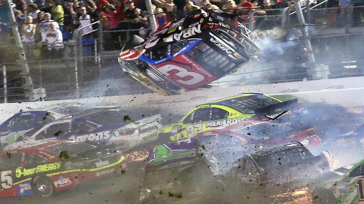 
Austin Dillon (3) goes airborne as he was involved in a multi-car crash on the final lap of the NASCAR Sprint Cup series auto race at Daytona International Speedway early Monday morning. 
