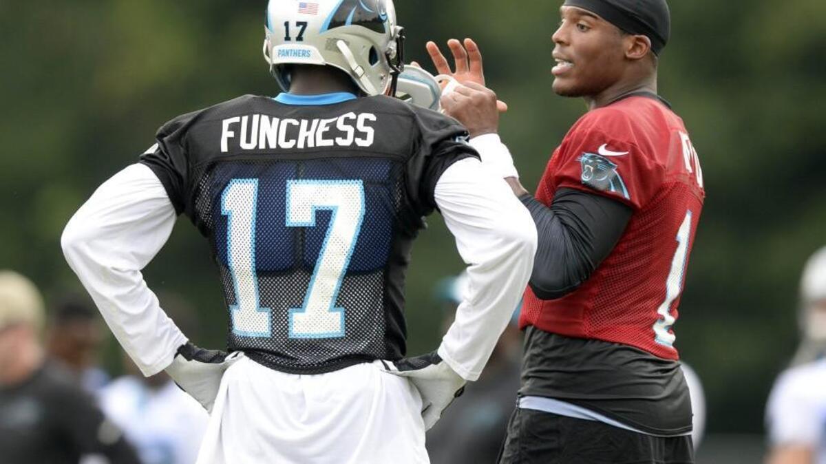 
Cam Newton (right) needs rookie Devin Funchess to step up quickly in the absence of Kelvin Benjamin. 
