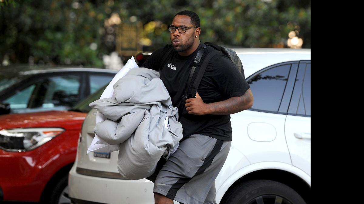 
Carolina Panthers guard Trai Turner carries some of his personal belongings into the team's dorm on the campus of Wofford College in Spartanburg on Thursday, July 30, 2015.
