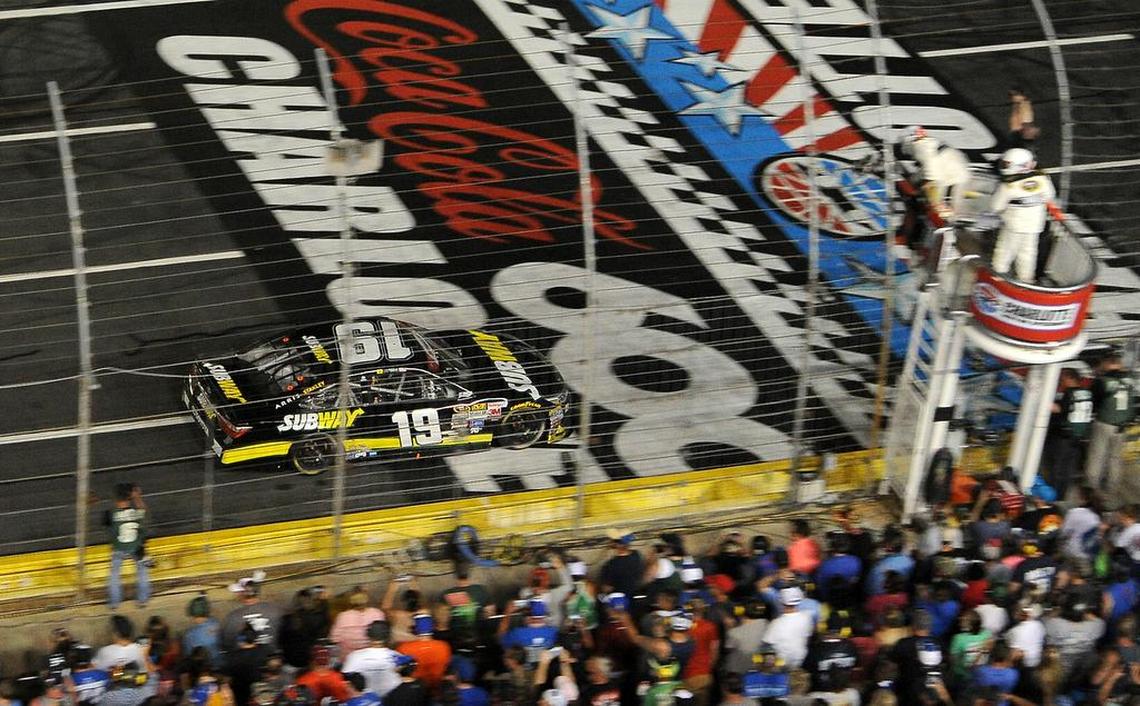NASCAR Sprint Cup Series driver Carl Edwards crosses the finish line to win the Coca-Cola 600 at Charlotte Motor Speedway on Sunday, May 24, 2015.