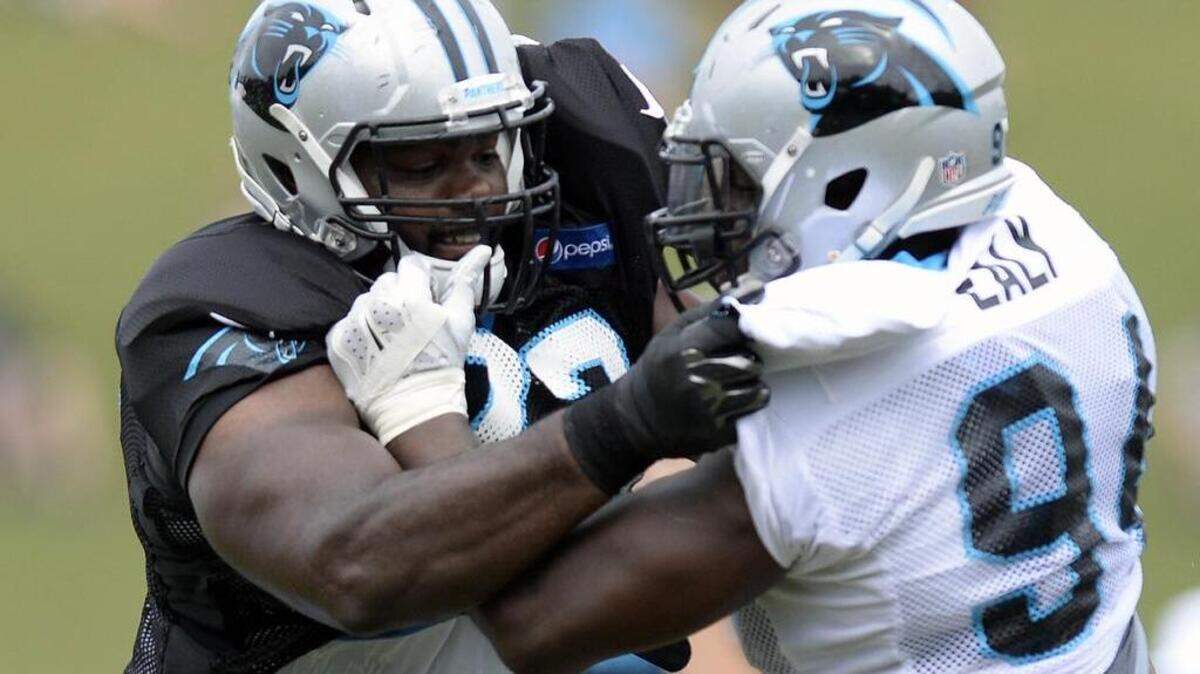 
Carolina Panthers tackle Michael Oher (73) and defensive end Kony Ealy (94) face off during a blocking drill on Monday. Head coach Ron Rivera and defensive coordinator Sean McDermott chastised the defense for its effort early in practice. 
