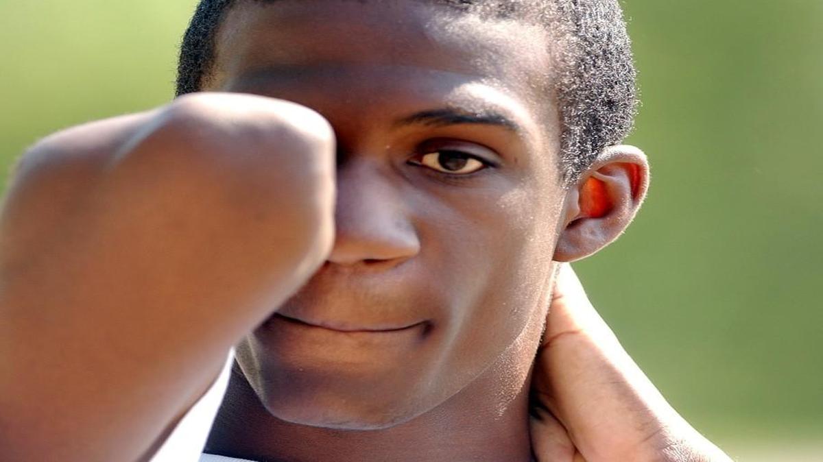 Lex Gillette has not let his visual impairment deter him from a successful athletic career. He is a blind Paralympian who has won numerous championships in long jump. He is seen here at Athens Drive in 2003.