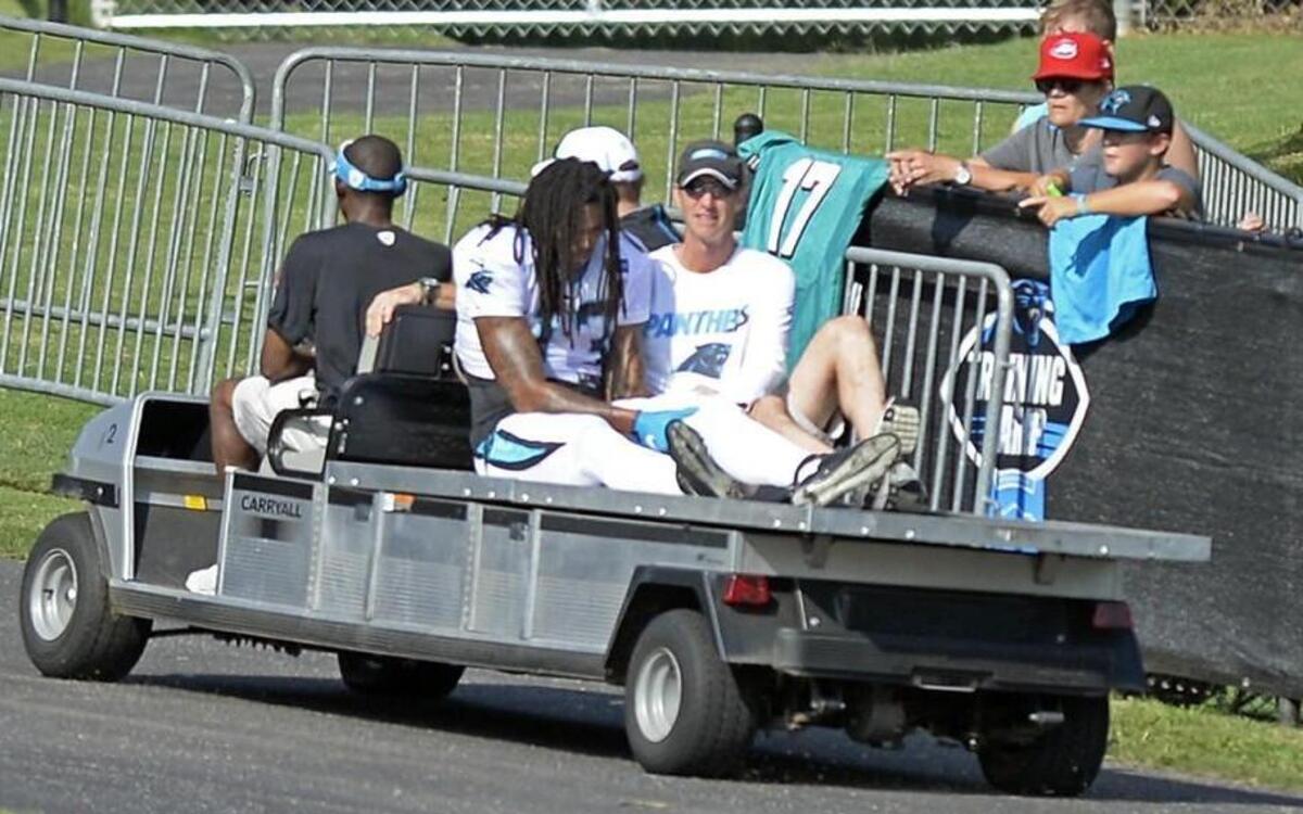 
Carolina Panthers' Kelvin Benjamin holds his leg as he is carted off the field with head athletic trainer Ryan Vermillion during a scrimmage against the Miami Dolphins during Carolina Panthers Training Camp at Wofford College in Spartanburg, SC on Wednesday.
