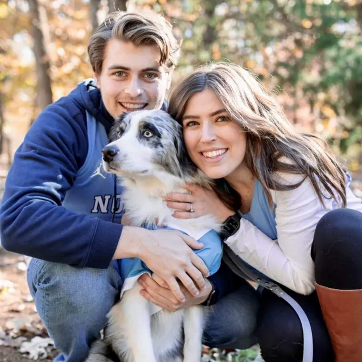 UNC alumni Ryan Kendall, left, and Kegan Cox, right, are getting married on Saturday night during the Duke game. They’re pictured with their dog, Maeve.