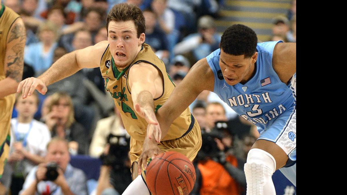 
Notre Dame guard Pat Connaughton (24) steals the ball from North Carolina forward Kennedy Meeks (3) late in the second half as Notre Dame defeated North Carolina 90-82 to win their first Atlantic Coast Conference men's basketball tournament championship Saturday, March 14, 2015 in Greensboro, N.C. 
