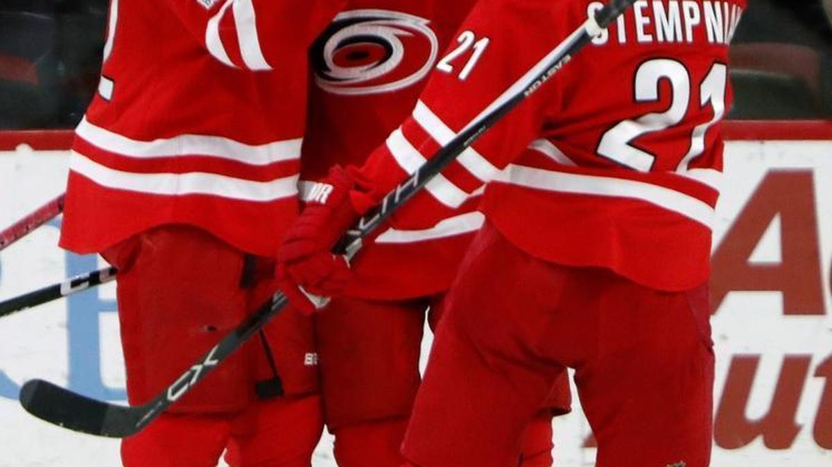 The Canes' Joakim Nordstrom, left, celebrates goal with Lucas Wallmark, center, and Lee Stempniak during game against the New York Islanders at PNC Arena on March 14, 2017.