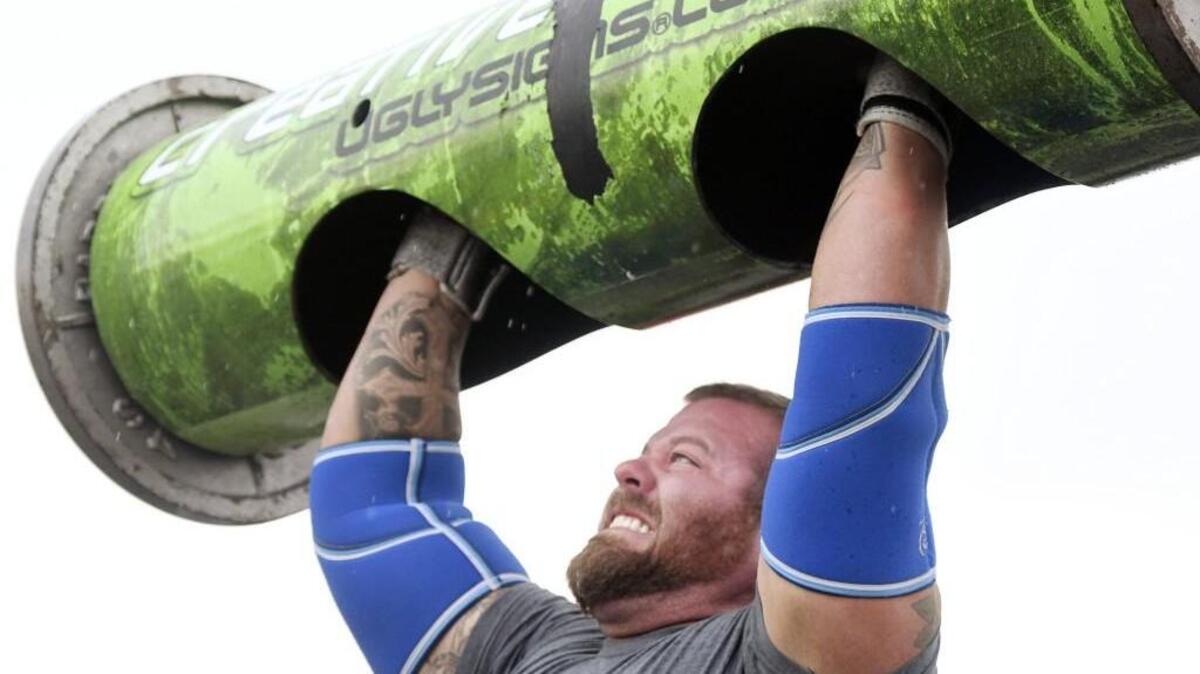 Matt Gonzalez of Macon competes in the log press during the 8th Annual Central Georgia’s Strongest Man competition on March 18, 2017.